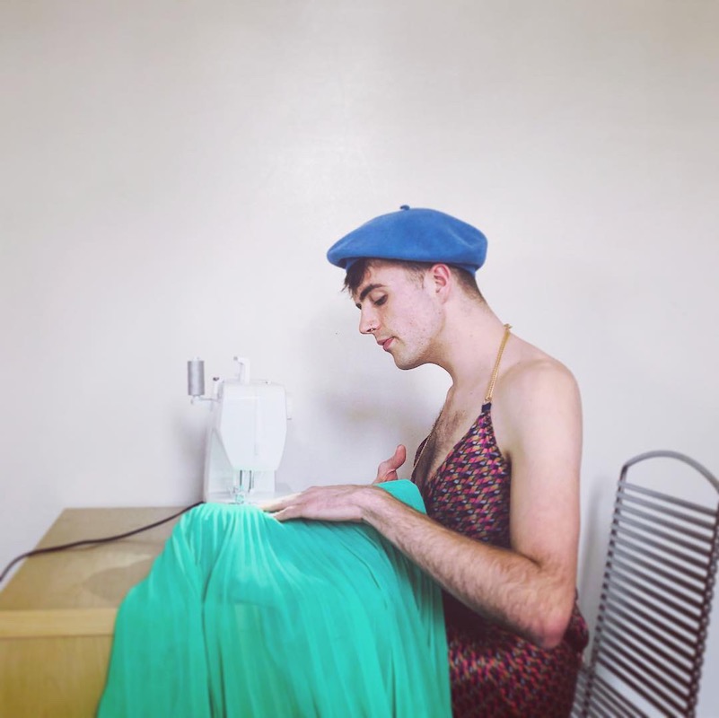 Tom Nuttall looking fabulous using sewing machine