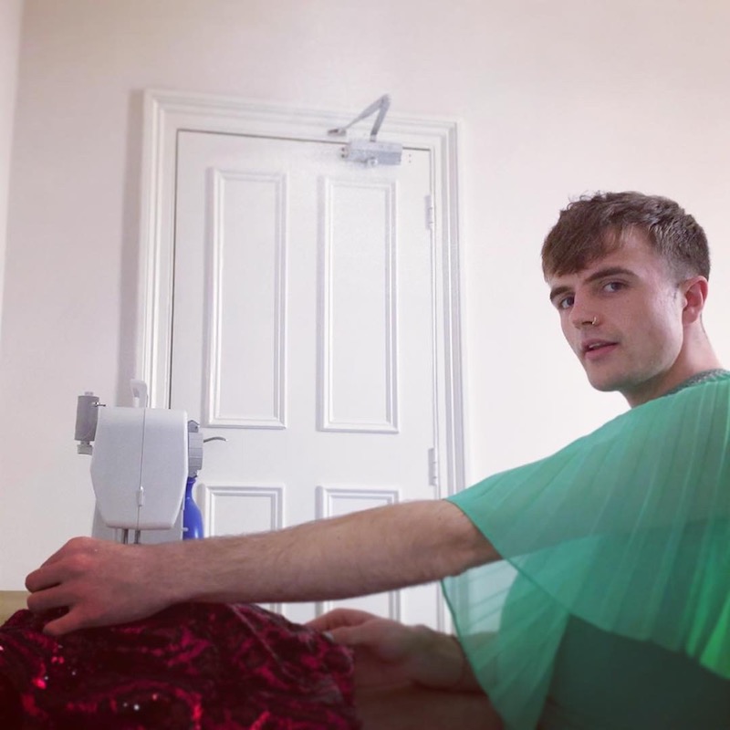 Man making a dress in a dress