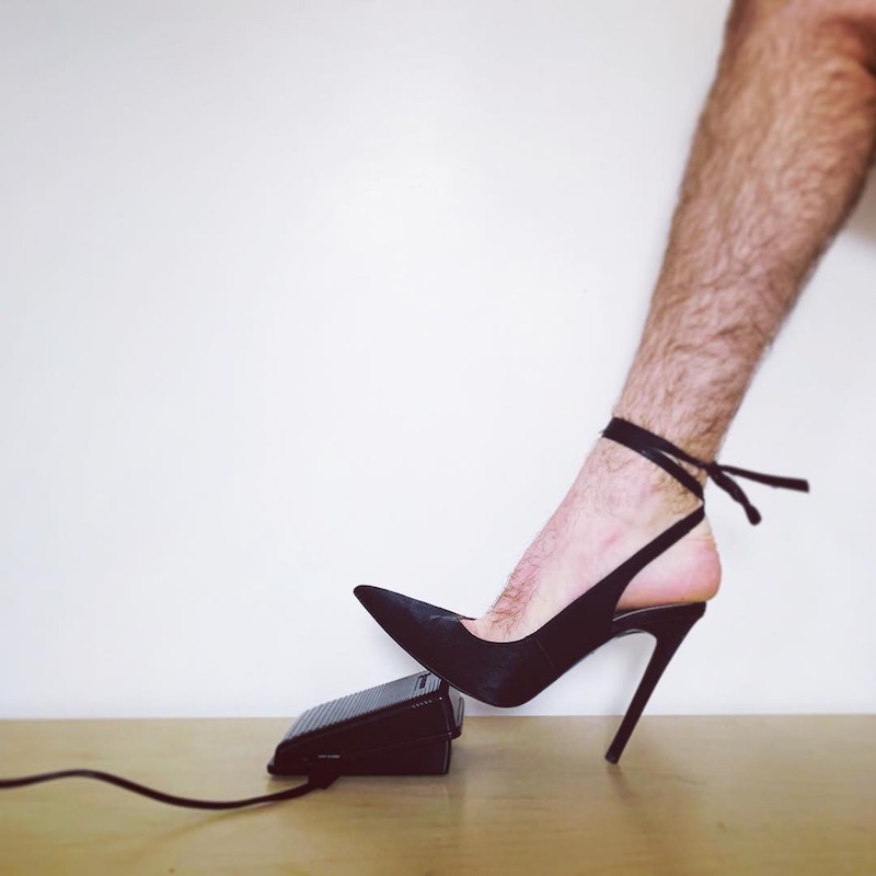 high heels pressing a sewing machine pedal