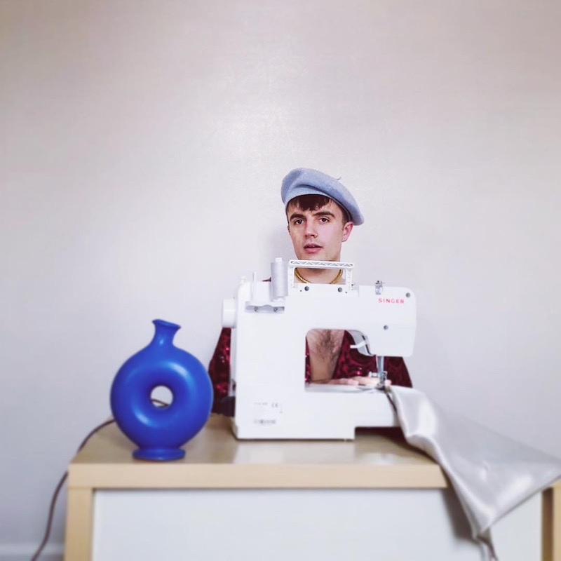 image from the front of Tom Nuttall at a sewing machine
